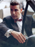 Stefano in suit driving car